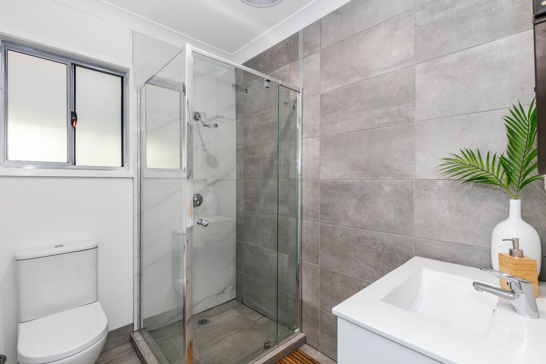 Renovated bathroom with a frameless shower, Woodridge renovation