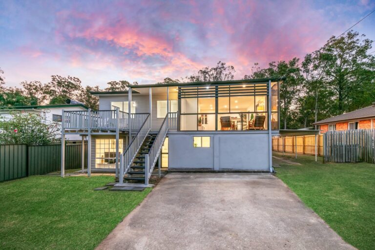 Rear of a renovated two-level house in Woodridge, QLD, at dusk