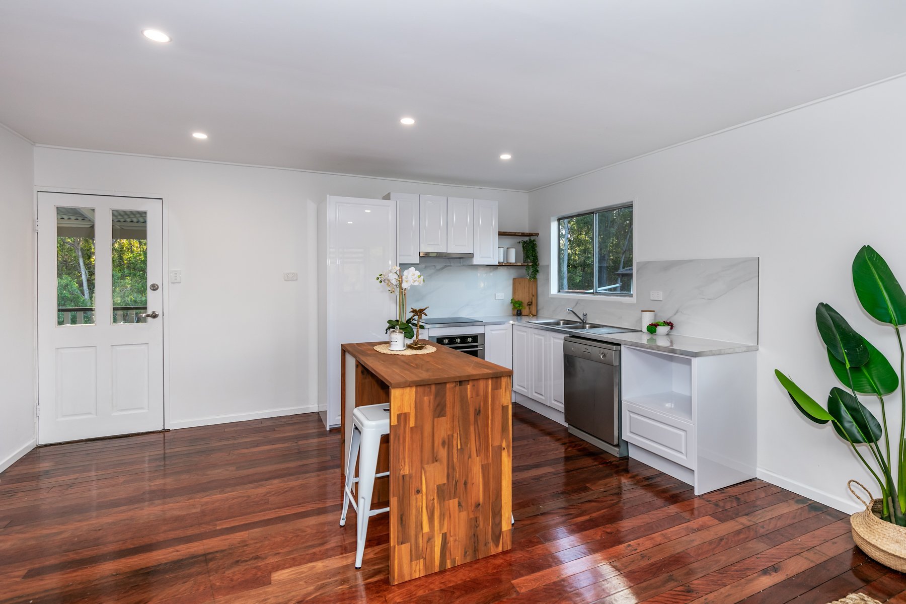 Renovated kitchen with a timber-top island, Woodridge renovation